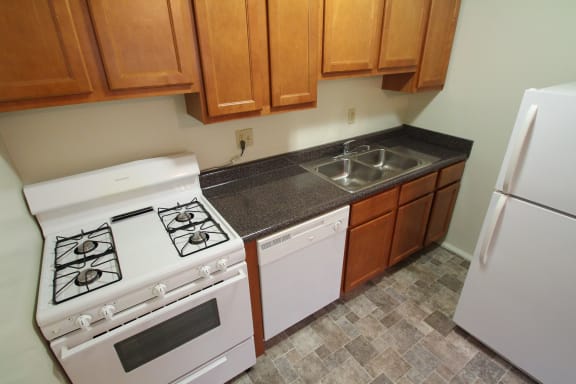 This is a photo of the kitchen in the 631 square foot 1 bedroom, 1 bath floor plan at Colonial Ridge Apartments in Cincinnati, OH.