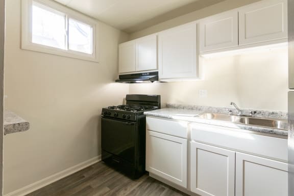This is a photo of the kitchen in the 550 square foot 1 bedroom, 1 bath patio apartment at College Woods Apartments in the North College Hill neighborhood of Cincinnati, OH.