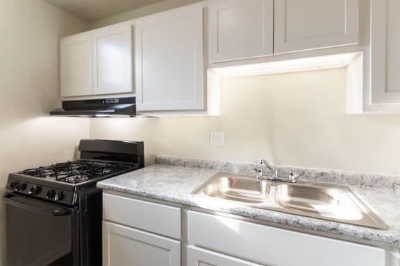 This is a photo of the kitchen in the 550 square foot 1 bedroom, 1 bath patio apartment at College Woods Apartments in the North College Hill neighborhood of Cincinnati, OH.
