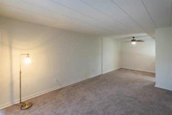 This is a photo of the living room dining area in the 550 square foot 1 bedroom, 1 bath patio apartment at College Woods Apartments in the North College Hill neighborhood of Cincinnati, OH.