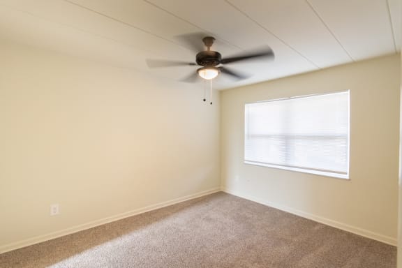 This is a photo of the bedroom in the 550 square foot 1 bedroom, 1 bath patio apartment at College Woods Apartments in the North College Hill neighborhood of Cincinnati, OH.