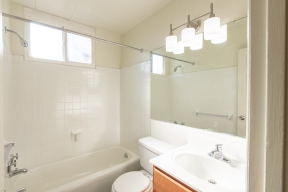 This is a photo of the bathroom in the 550 square foot 1 bedroom, 1 bath patio apartment at College Woods Apartments in the North College Hill neighborhood of Cincinnati, OH.