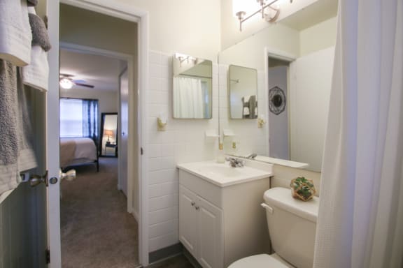 This is a photo of the bathroom of the 550 square foot 1 bedroom, 1 bath, balcony floor plan model apartment at College Woods Apartments in Cincinnati, OH.