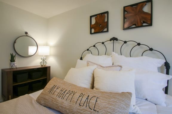 This is a photo of the bedroom of the 550 square foot 1 bedroom, 1 bath, balcony floor plan model apartment at College Woods Apartments in Cincinnati, OH.