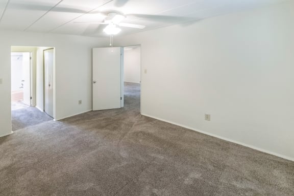 This is a photo of the bedroom of the 550 square foot 1 bedroom, balcony floor plan model apartment at College Woods Apartments in Cincinnati, OH.