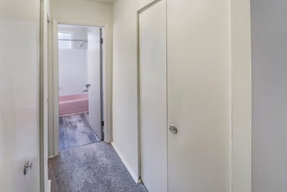 This is a photo of the bedroom hallway closets of the 550 square foot 1 bedroom, balcony floor plan model apartment at College Woods Apartments in Cincinnati, OH.