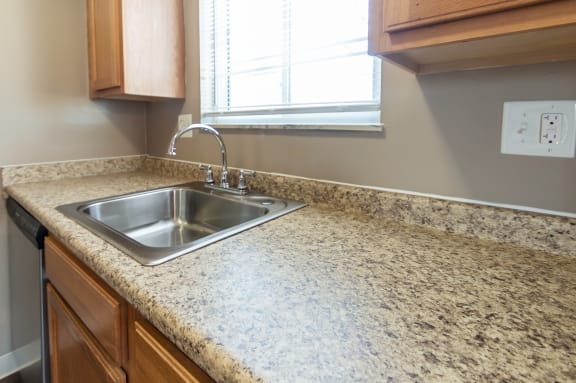This is a photo of the kitchen of an upgraded 650 square foot, 1 bedroom apartment at Deer Hill Apartments in Cincinnati, OH.