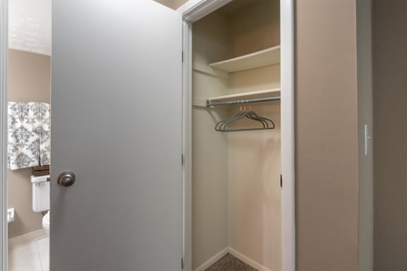 This is a photo of the living room closet in the upgraded 650 square foot, 1 bedroom, 1 bath model apartment at Deer Hill Apartments in Cincinnati, Ohio.