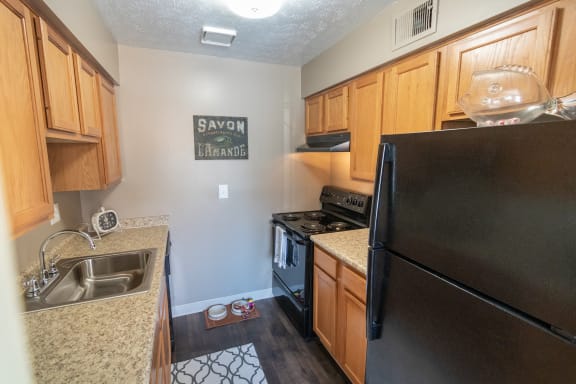 This is a photo of the kitchen in the upgraded 650 square foot, 1 bedroom model apartment at Deer Hill Apartments in Cincinnati, Ohio.
