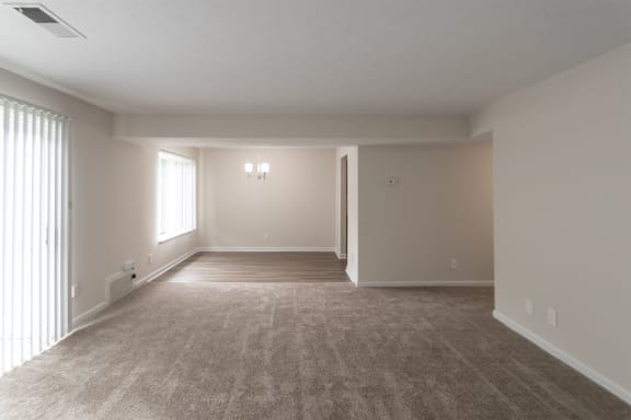 This is a photo of the dining room from the living room in an upgraded 950 square foot, 2 bedroom apartment at Deer Hill Apartments in Cincinnati, OH.