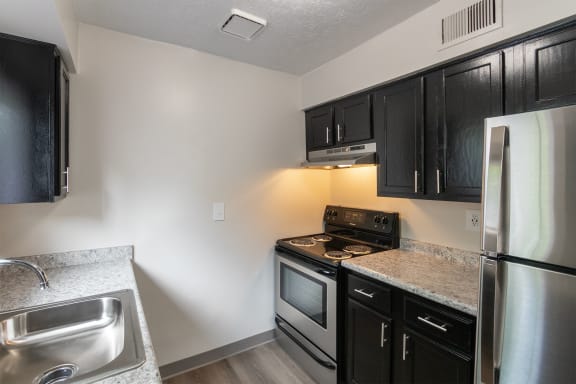 This is a photo of the kitchen in an upgraded 950 square foot, 2 bedroom apartment at Deer Hill Apartments in Cincinnati, OH.