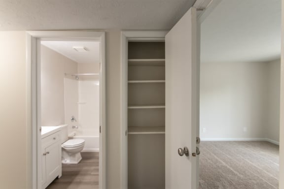This is a photo of the hall linen closet in an upgraded 950 square foot, 2 bedroom apartment at Deer Hill Apartments in Cincinnati, OH.