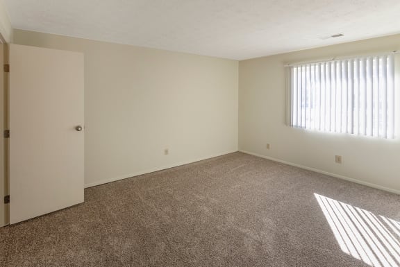 This is a photo of the master bedroom of a 950 square foot, standard 2 bedroom apartment at Deer Hill Apartments in Cincinnati, OH.