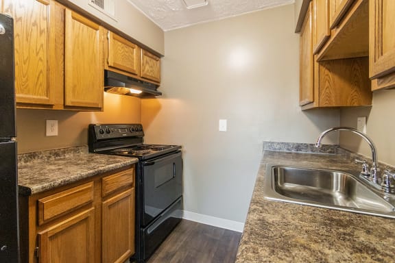 This is a photo of the kitchen of an upgraded 950 square foot, 2 bedroom apartment at Deer Hill Apartments in Cincinnati, OH.