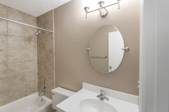 This is a photo of the bathroom of an upgraded 950 square foot, 2 bedroom apartment at Deer Hill Apartments in Cincinnati, OH.
