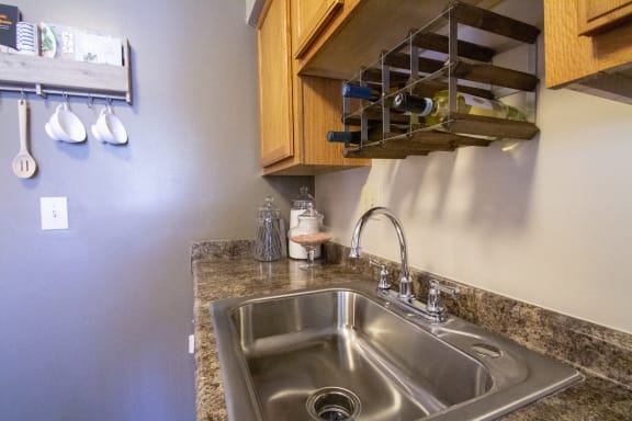 This is a closeup photo of the sink area in the kitchen of a 2 bedroom apartment at Deer Hill Apartments in Cincinnati, OH.
