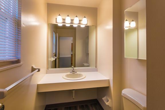 The half bath in the 1460 square foot, 3 bedroom, 2 and a half bath townhome at Fairfield Pointe Apartments in Fairfield, OH.