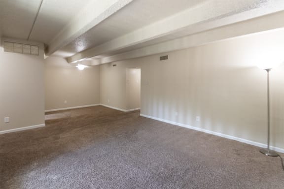 This is a photo of the living room in the 965 square foot 2 bedroom, 2 bath  apartment at Harvard Square Apartments, in Dallas, TX.