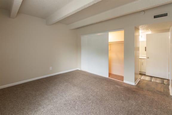 This is a photo of the primary bedroom in the 965 square foot 2 bedroom, 2 bath  apartment at Harvard Square Apartments, in Dallas, TX.
