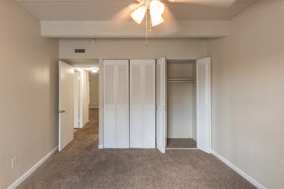 This is a photo of the second bedroom in the 965 square foot 2 bedroom, 2 bath  apartment at Harvard Square Apartments, in Dallas, TX.