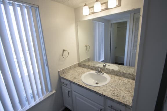 This is a bathroom vanity of the kitchen of a 500 square foot 1 bedroom apartment at Harvard Square Apartments in Dallas, TX.