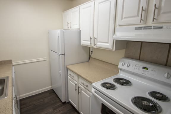 This is a photo of the kitchen in the 653 square foot 1 bedroom apartment at Harvard Square Apartments, in Dallas, TX.