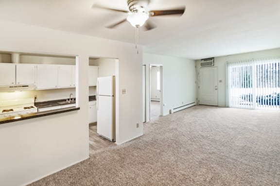 This is a photo of the kitchen and living from the dining area of a 1 bedroom, 631 square foot apartment at Lake of the Woods Apartments in Cincinnati, OH.