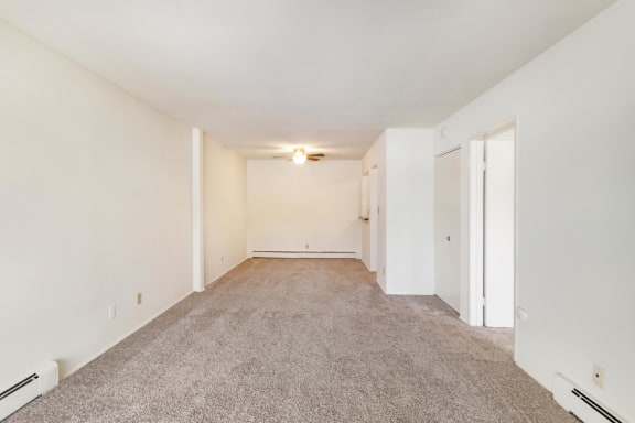 This is a photo of the living room and dining area of a 1 bedroom, 631 square foot apartment at Lake of the Woods Apartments in Cincinnati, OH.