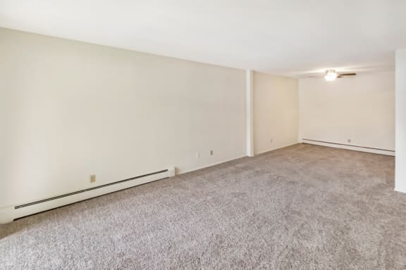This is a photo of the living room and dining area of a 1 bedroom, 631 square foot apartment at Lake of the Woods Apartments in Cincinnati, OH.