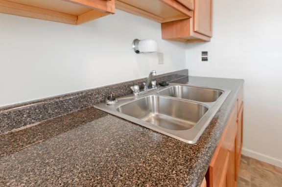 This is a photo of the kitchen of a 2 bedroom, 758 square foot apartment at Lake of the Woods Apartments in Cincinnati, OH.
