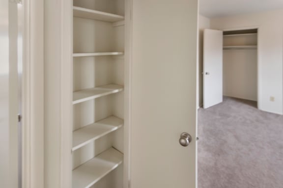 This is a photo of the hallway linen closet in a 2 bedroom, 758 square foot apartment at Lake of the Woods Apartments in Cincinnati, OH.
