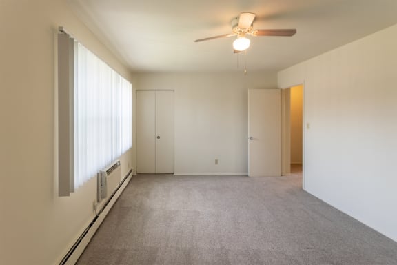 This is a photo of the master bedroom in the 1004 square foot, 2 bedroom, 1.5 bath townhome floor plan at Lake of the Woods Apartments in Cincinnati, OH.