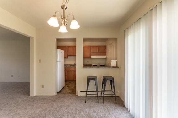This is a photo of the dining room in the 758 square foot, 2 bedroom floor plan at Lake of the Woods Apartments in Cincinnati, OH.
