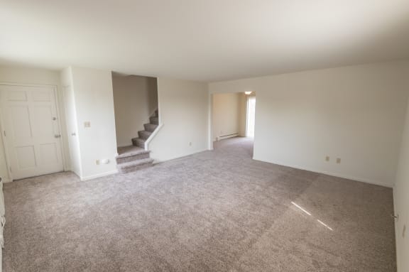 This is a photo of the living room in the 1229 square foot, 3 bedroom, 2.5 bath townhome floor plan at Lake of the Woods Apartments in Cincinnati, OH.