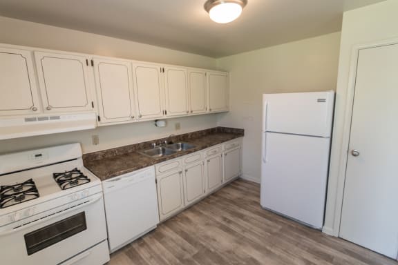This is a photo of the kichen in the 1229 square foot, 3 bedroom, 2.5 bath townhome floor plan at Lake of the Woods Apartments in Cincinnati, OH.