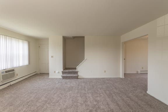 This is a photo of the living room in the 1229 square foot, 3 bedroom, 2.5 bath townhome floor plan at Lake of the Woods Apartments in Cincinnati, OH.