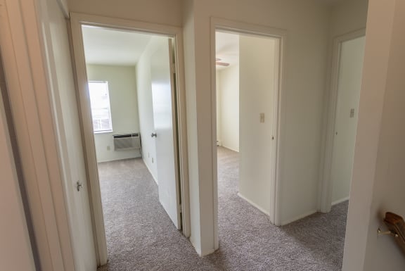 This is a photo of the upstairs hallway in the 1229 square foot, 3 bedroom, 2.5 bath townhome floor plan at Lake of the Woods Apartments in Cincinnati, OH.