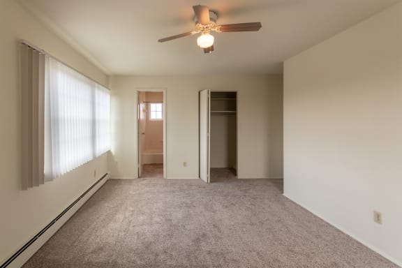 This is a photo of the master bedroom in the 1229 square foot, 3 bedroom, 2.5 bath townhome floor plan at Lake of the Woods Apartments in Cincinnati, OH.