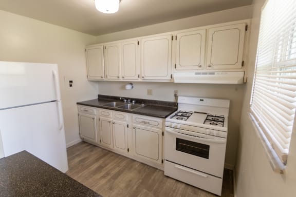 This is a photo of the kitchen in the 966 square foot, 2 bedroom, 1 bath floor plan at Lake of the Woods Apartments in Cincinnati, OH.