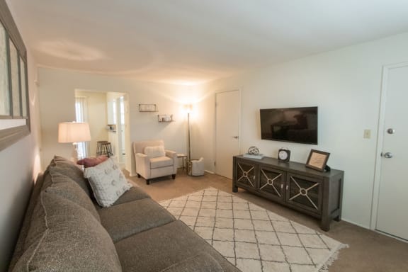 This is a photo of the living room of the 1 bedroom, 631 square foot model apartment at Lake of the Woods Apartments in Cincinnati, OH.