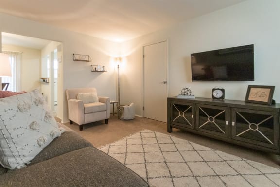 This is a photo of the living room of the 1 bedroom, 631 square foot model apartment at Lake of the Woods Apartments in Cincinnati, OH.