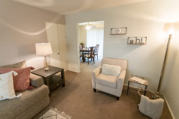 This is a photo of the living room of the 1 bedroom, 631 square foot model apartment at Lake of the Woods Apartments in Cincinnati, OH.