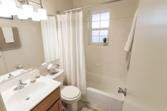 This is a photo of the bathroom of the 1 bedroom, 631 square foot model apartment at Lake of the Woods Apartments in Cincinnati, OH.