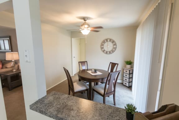 This is a photo of the dining room of the 1 bedroom, 631 square foot model apartment at Lake of the Woods Apartments in Cincinnati, OH.