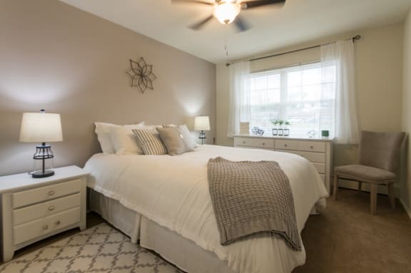 This is a photo of the bedroom of the 1 bedroom, 631 square foot model apartment at Lake of the Woods Apartments in Cincinnati, OH.
