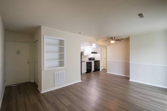 This is a photo of the living room with built-in bookshelf of the 560 square foot 1 bedroom, 1 bath Elm floor plan at Montana Valley Apartments in Cincinnati, OH.