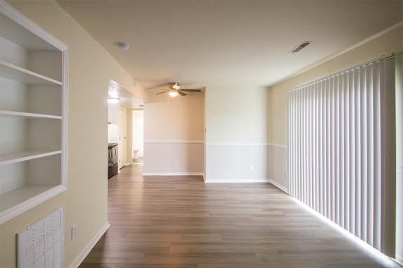 This is a photo of the living room with built-in bookshelf of the 560 square foot 1 bedroom, 1 bath Elm floor plan at Montana Valley Apartments in Cincinnati, OH.