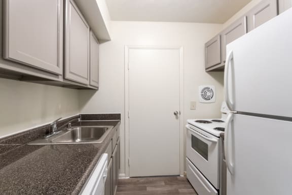 This is a photo the kitchen of the 940 square foot, Sycamore 2 bedroom, 1 bath apartment at Montana Valley Apartments in the Westwood neighborhood of Cincinnati, OH.