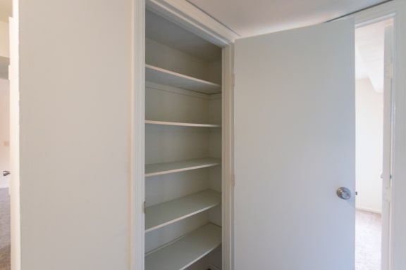 This is a photo the large hall linen closet of the 940 square foot, Sycamore 2 bedroom, 1 bath apartment at Montana Valley Apartments in the Westwood neighborhood of Cincinnati, OH.