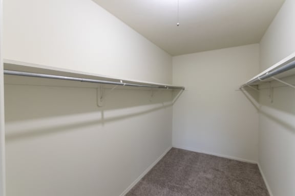 This is a photo the huge primary bedroom walk-in closet of the 1030 square foot, Oak 2 bedroom, 1 bath apartment at Montana Valley Apartments in the Westwood neighborhood of Cincinnati, OH.